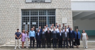 Deputy Foreign Minister and Director for EU Affairs Ambassador Mehmet Kemal Bozay (L-6) poses with the members of the Celal Bayar Minority Secondary and High School in Komotini (Gümülcine), Greece, July 25, 2024. (AA Photo)