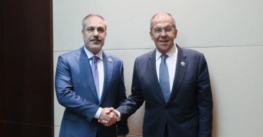 Turkish Foreign Minister Hakan Fidan (L) shakes hands with Russia's Foreign Minister Sergey Lavrov at the 57th Association of Southeast Asian Nations (ASEAN) Foreign Ministers' Meeting, Vientiane, Laos, July 26, 2024. (AFP Photo)