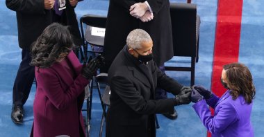 Vice President Kamala Harris (R) is greeted by former President Barack Obama (C) and Michelle Obama as they arrive at the 59th Presidential Inauguration on the West Front of the U.S. Capitol, Washington, U.S., Jan. 20, 2021. (Getty Images Photo)