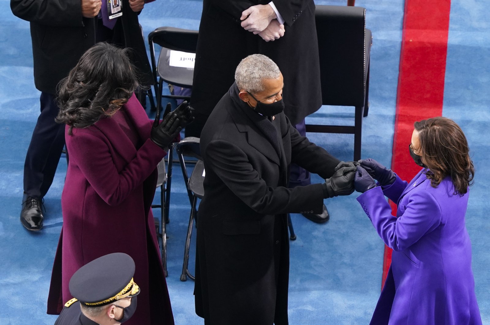 Vice President Kamala Harris (R) is greeted by former President Barack Obama (C) and Michelle Obama as they arrive at the 59th Presidential Inauguration on the West Front of the U.S. Capitol, Washington, U.S., Jan. 20, 2021. (Getty Images Photo)