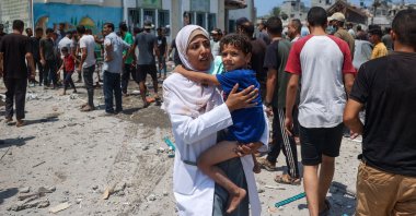 Palestinians flee Khadija school housing displaced people after an Israeli strike, in Deir al-Balah, in the central Gaza Strip, Palestine, July 27, 2024. (AFP Photo)