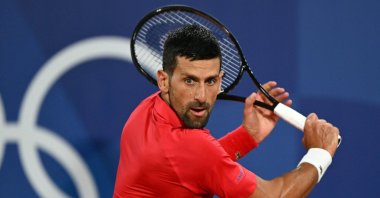 Serbia's Novak Djokovic returns to Australia's Matthew Ebden during their men's singles first round tennis match on Court Philippe-Chatrier at the Roland-Garros Stadium at the Paris 2024 Olympic Games, Paris, France, July 27, 2024. (AFP Photo)