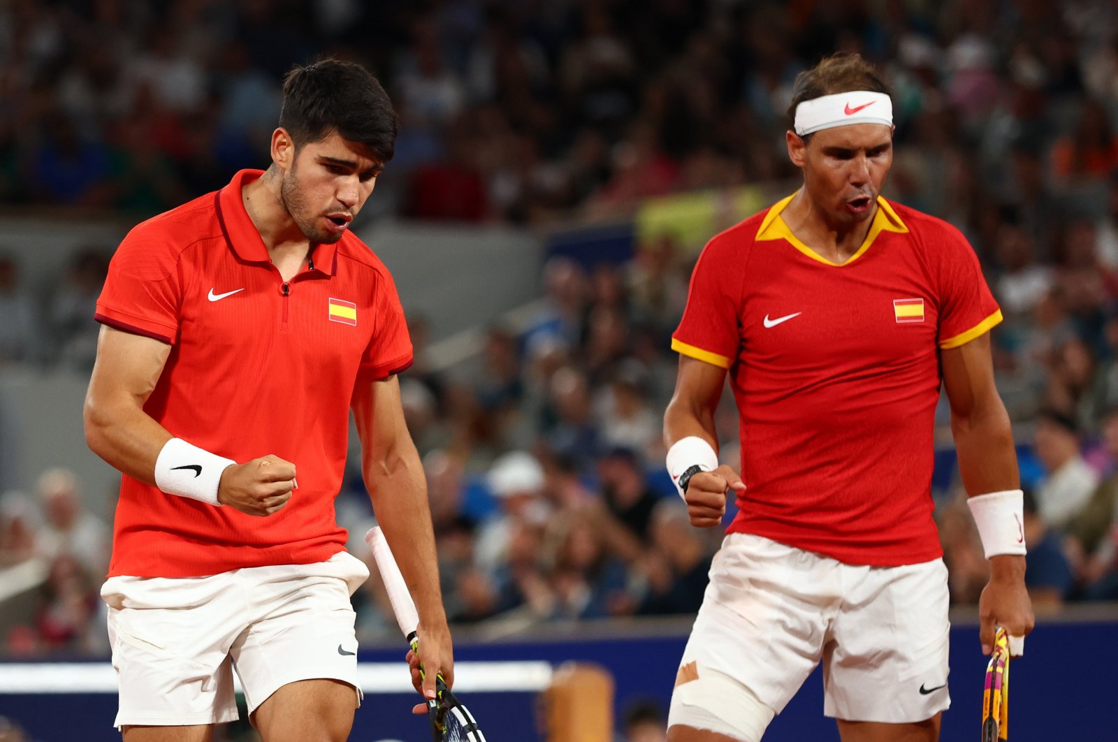 Rafael Nadal (R) and Carlos Alcaraz of Spain react during their Men&#039;s Doubles first round match against Maximo Gonzalez and Andres Molteni of Argentina at the Paris 2024 Olympic Games, Roland Garros, Paris, France, July 27, 2024. (EPA Photo)