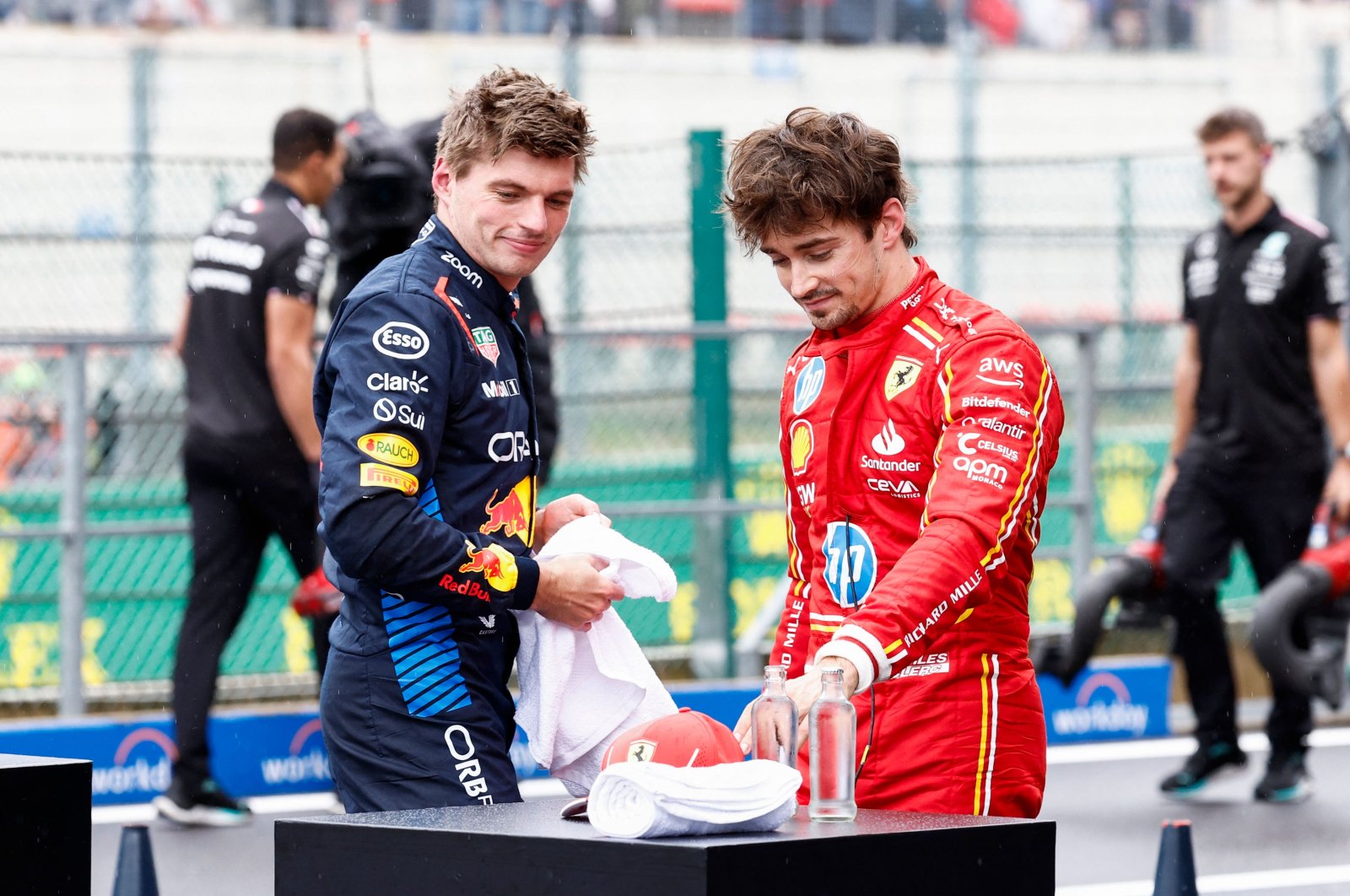 Red Bull Racing&#039;s Dutch driver Max Verstappen (L) and Ferrari&#039;s Monegasque driver Charles Leclerc react after the qualifying session ahead of the Formula One Belgian Grand Prix at the Spa-Francorchamps Circuit, Spa, Belgium, July 27, 2024. (AFP Photo)