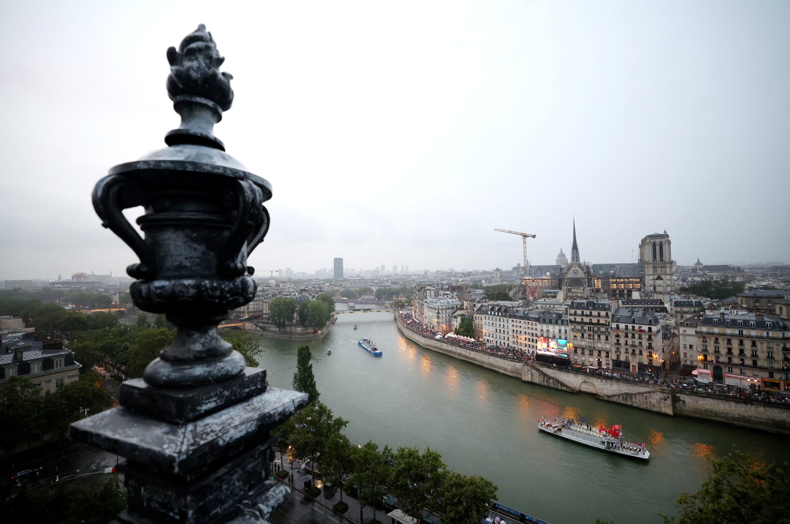 Boats arrive during the athletes&#039; parade on the River Seine during the opening ceremony of the Olympic Games Paris 2024, Paris, France, July 26, 2024. (Reuters Photo)