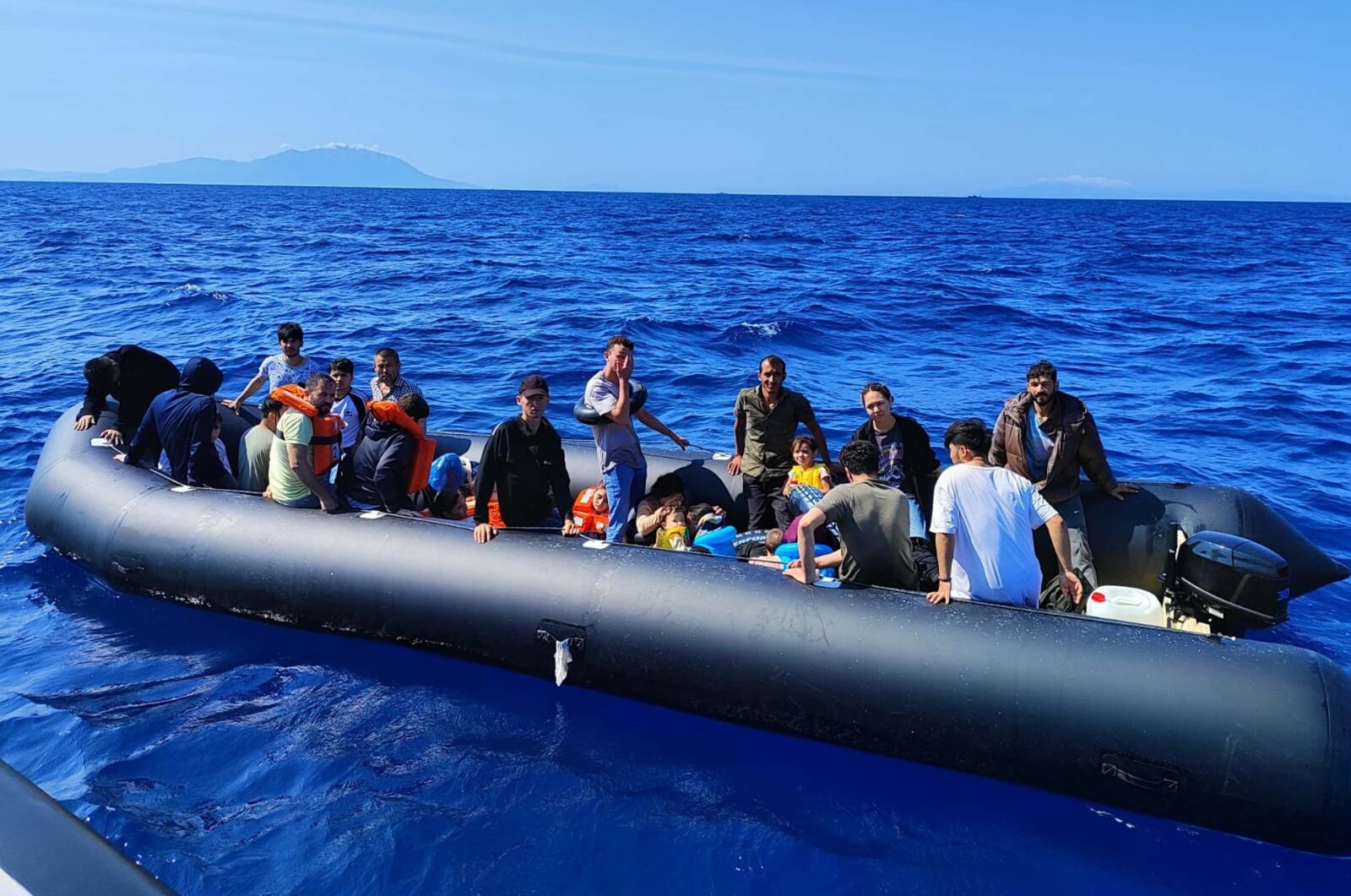 A group of irregular migrants wait to be rescued after being intercepted by the Turkish coast guard off the coast of Izmir, western Türkiye, July 28, 2024. (DHA Photo)