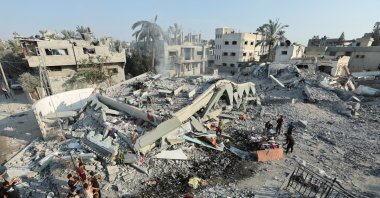 Palestinians inspect a destroyed mosque, following an Israeli strike, in Deir al-Balah, Gaza Strip, Palestine, July 27, 2024. (Reuters Photo)