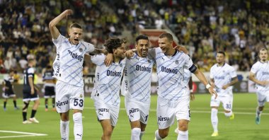 (L-R) Fenerbahçe's Sebastian Szymanski, Ferdi Kadıoğlu, Irfan Can Kahveci and Edin Dzeko celebrate after Ferdi Kadioğlu scored the 2-4 goal during the UEFA Champions League qualifying second round first leg match against Lugano, Thun, Switzerland, July 23, 2024. (EPA Photo)