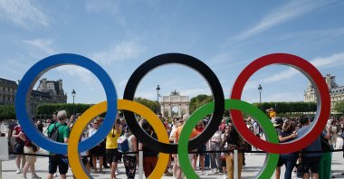 This photograph shows the Olympic rings in front of the Louvre pyramid, as part of the Paris 2024 Olympic Games, Paris, France, July 28, 2024. (AFP Photo)