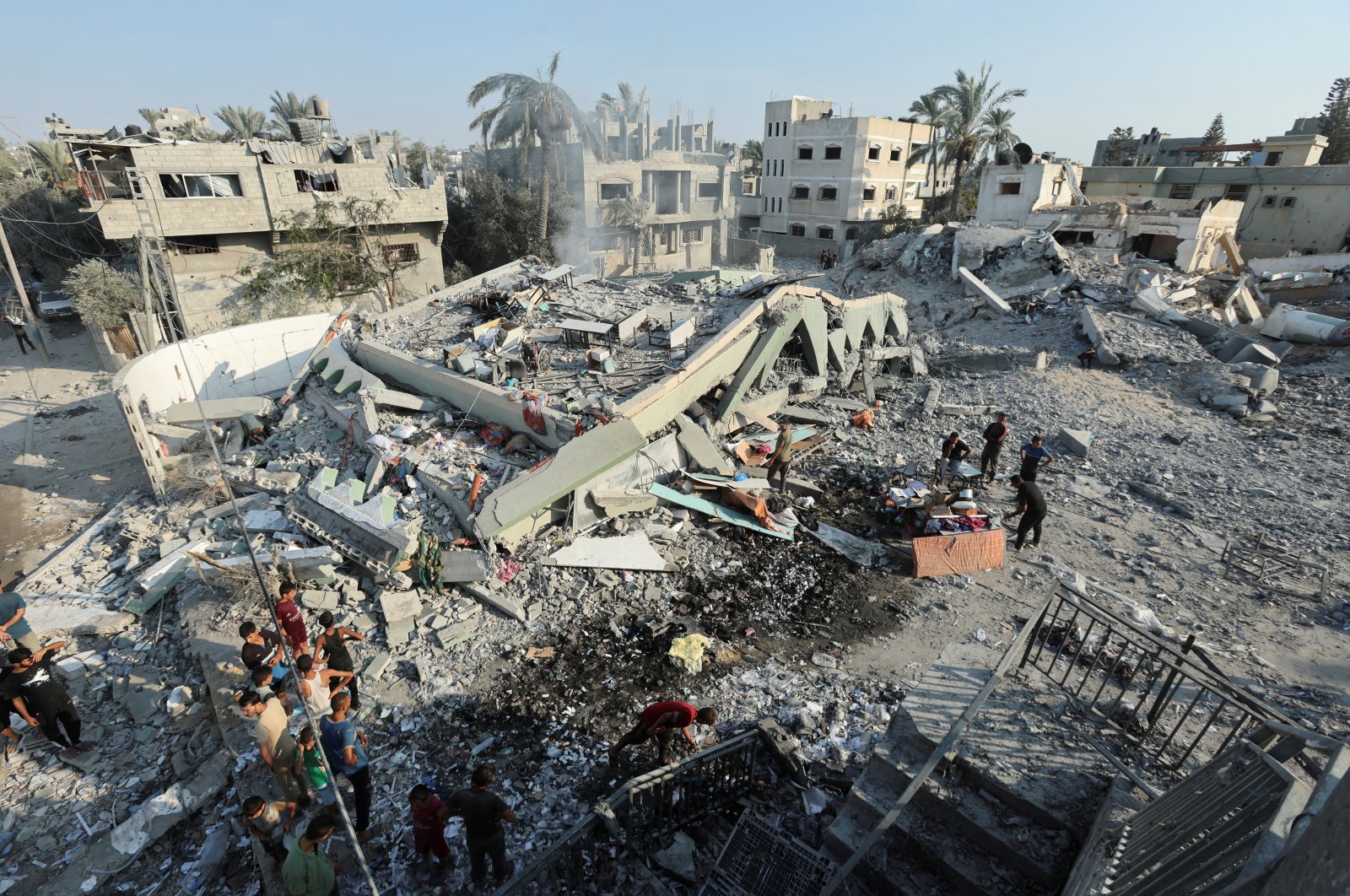 Palestinians inspect a destroyed mosque, following an Israeli strike, in Deir al-Balah, Gaza Strip, Palestine, July 27, 2024. (Reuters Photo)