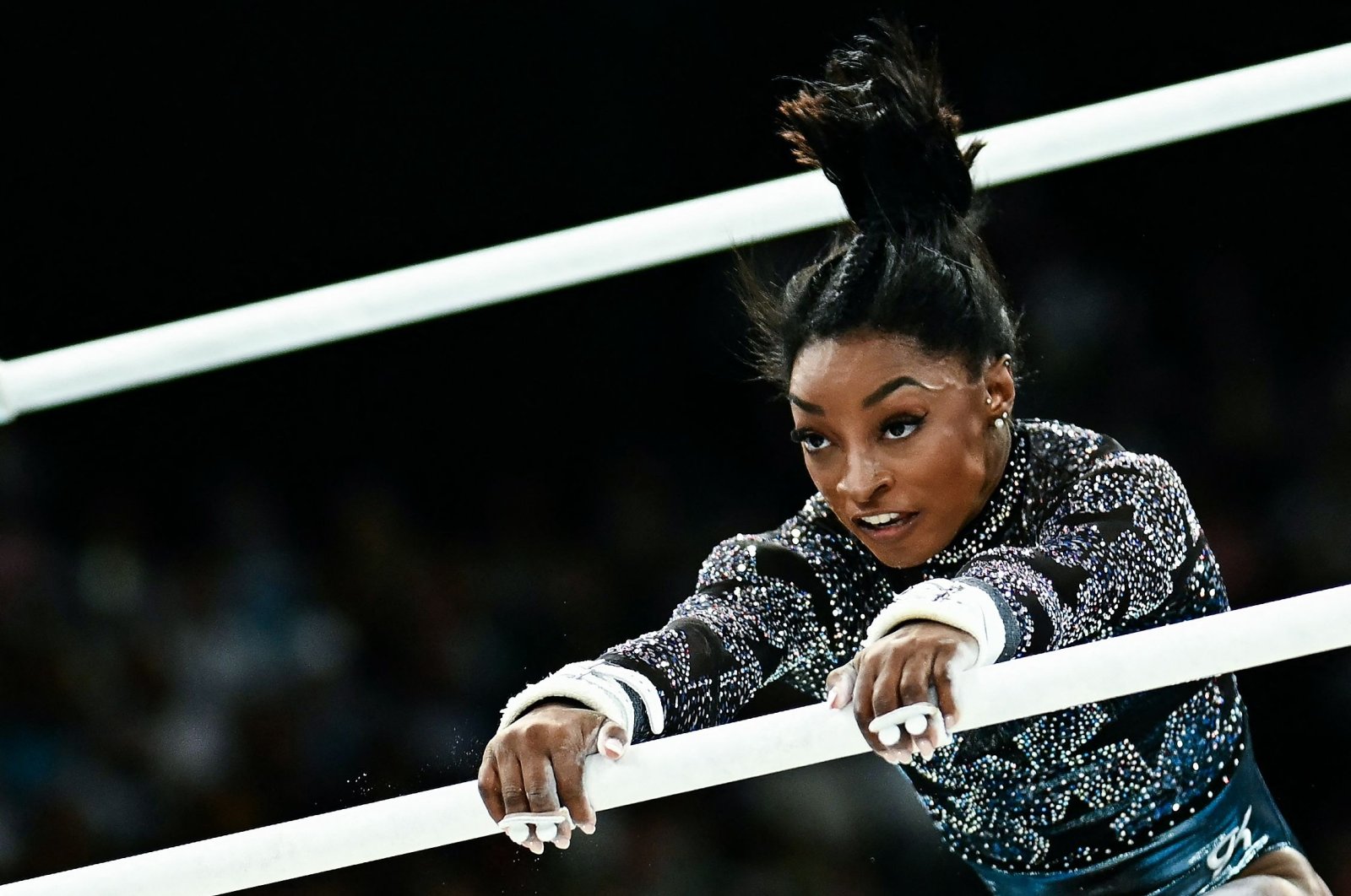 U.S.&#039; Simone Biles competes in the uneven bars event of the artistic gymnastics women&#039;s qualification during the Paris 2024 Olympic Games at the Bercy Arena, Paris, France, July 28, 2024. (AFP Photo)