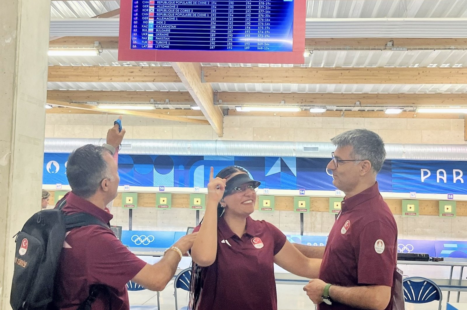 Turkish shooters Yusuf Dikeç (R) and Şevval İlayda Tarhan celebrate after securing a Paris 2024 Olympics finals spot, Paris, France, July 29, 2024. (DHA Photo)