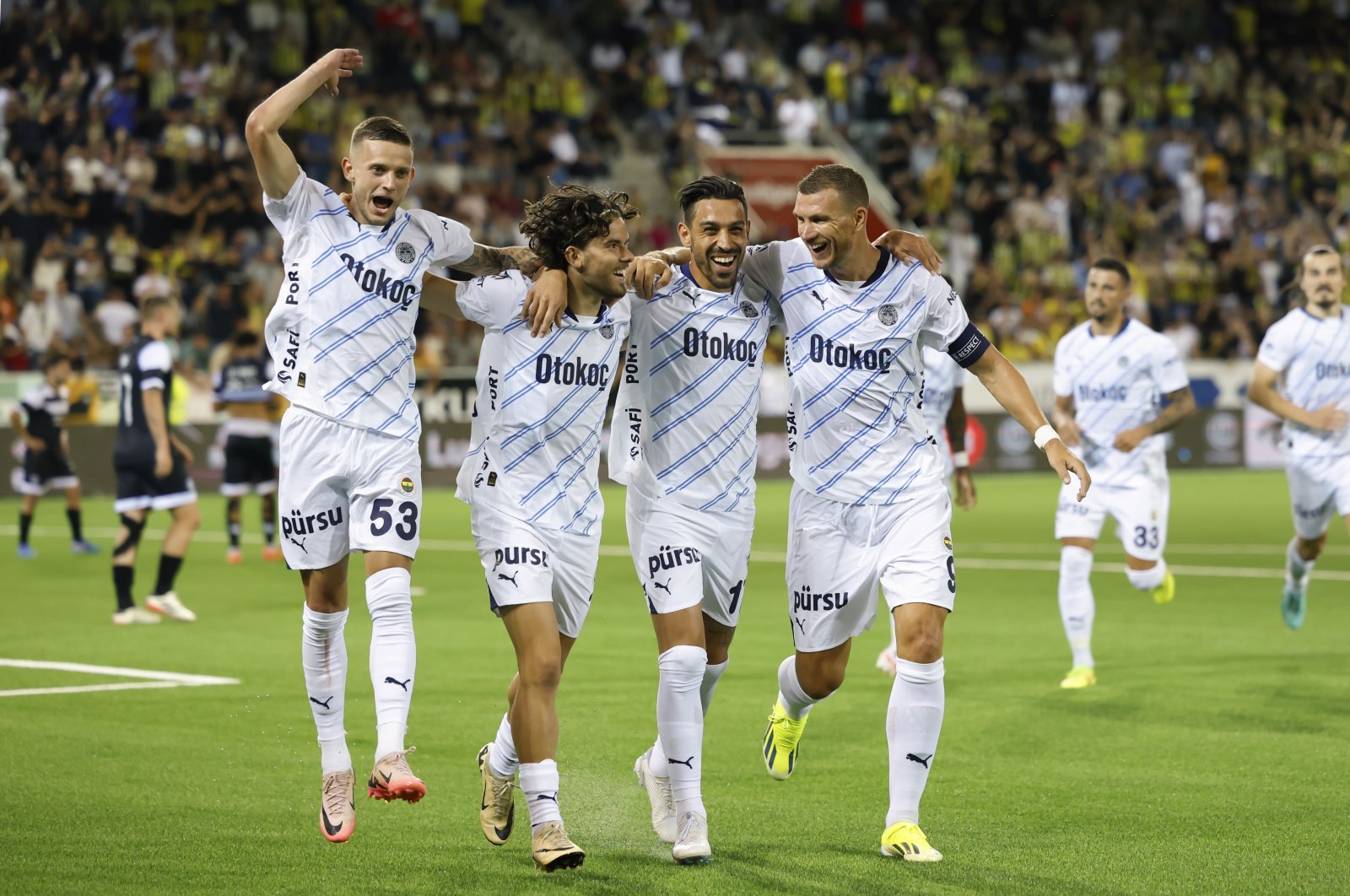 (L-R) Fenerbahçe&#039;s Sebastian Szymanski, Ferdi Kadıoğlu, Irfan Can Kahveci and Edin Dzeko celebrate after Ferdi Kadioğlu scored the 2-4 goal during the UEFA Champions League qualifying second round first leg match against Lugano, Thun, Switzerland, July 23, 2024. (EPA Photo)