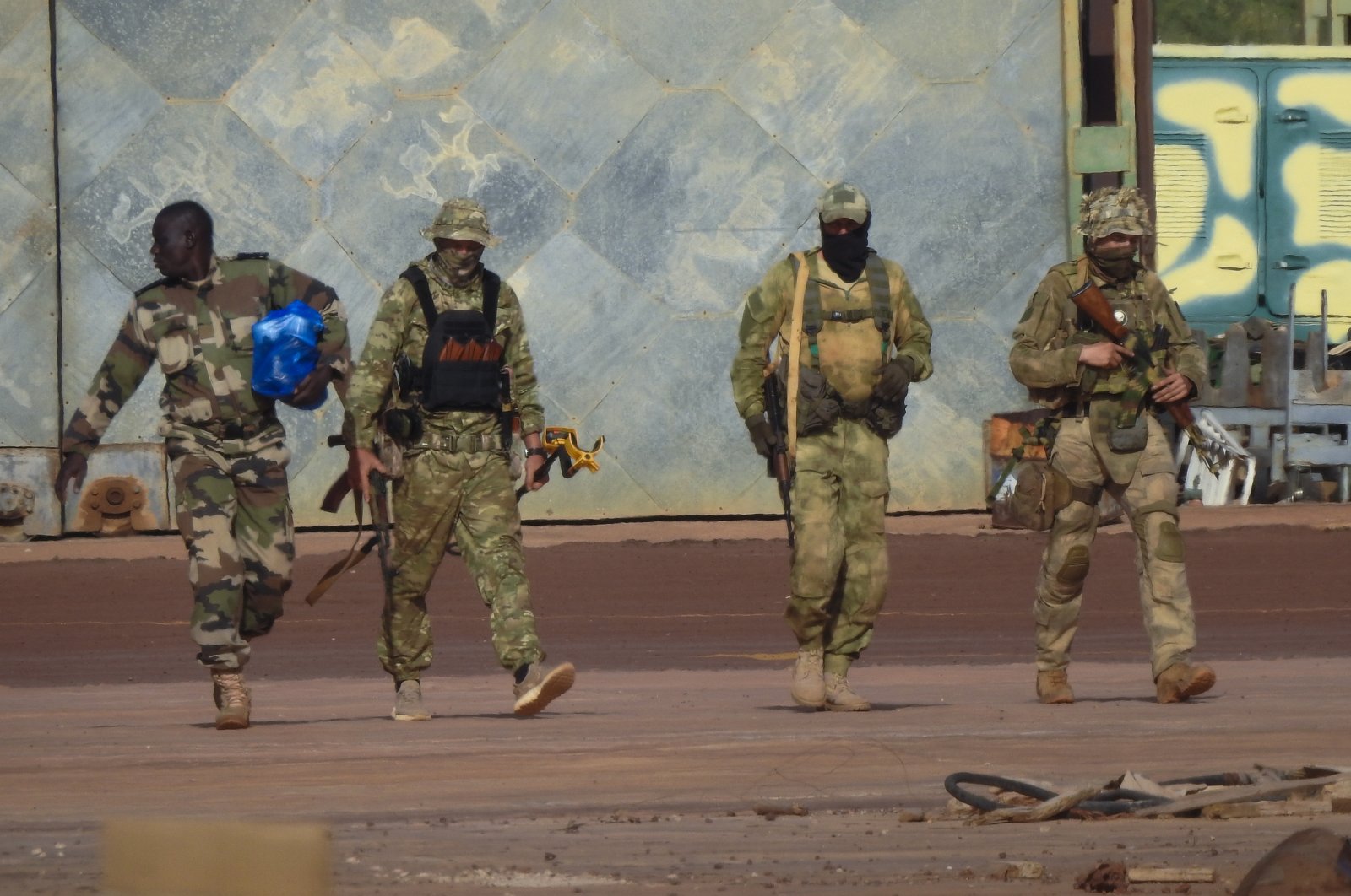 This undated photo shows three Russian mercenaries in northern Mali, (AP Photo)