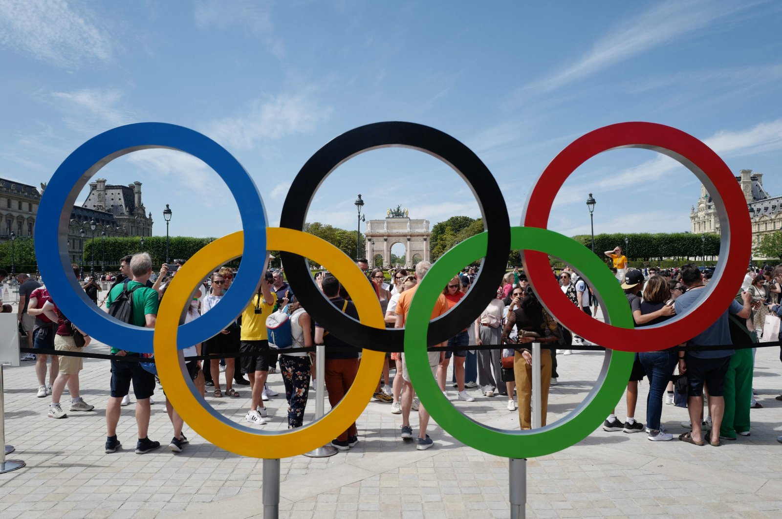 This photograph shows the Olympic rings in front of the Louvre pyramid, as part of the Paris 2024 Olympic Games, Paris, France, July 28, 2024. (AFP Photo)