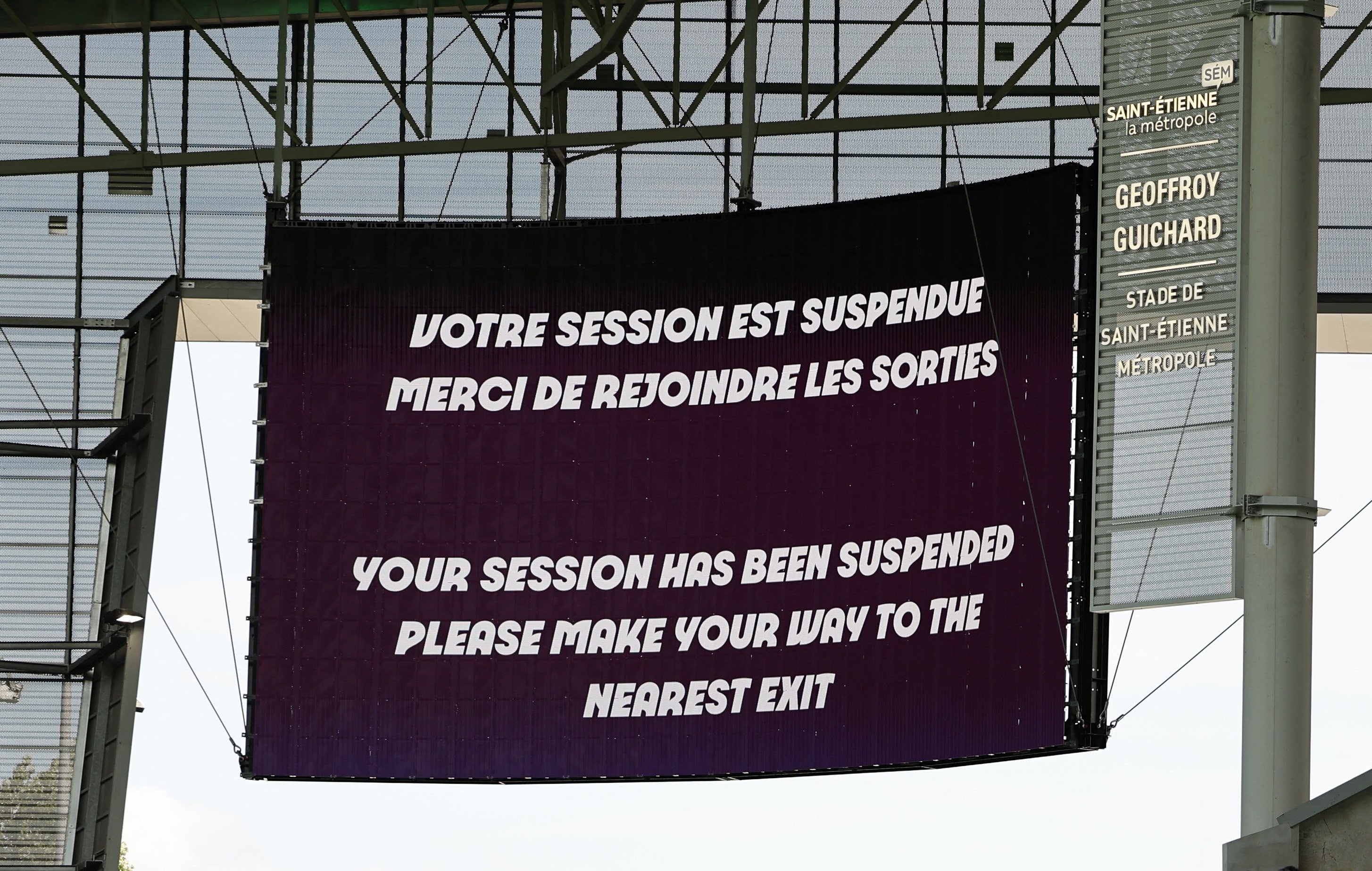 A big screen displays a message to leave the stadium after the suspension of the Paris 2024 Olympics men's football match between Argentina and Morocco at the Geoffroy-Guichard Stadium, Saint-Etienne, France, July 24, 2024. (Reuters Photo) 