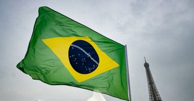 The flag of Brazil flutters below the Eiffel Tower on the boat of the athletes from Brazil's delegation along the river Seine during the opening ceremony of the Paris 2024 Olympics, Paris, France, July 26, 2024. (Reuters Photo)