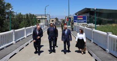 Türkiye&#039;s representative, Ambassador Serdar Kılıç (2nd R), and Armenia&#039;s representative, Ruben Rubinyan (2nd L), walk on the border between the two countries, July 30, 2024. (AA Photo)