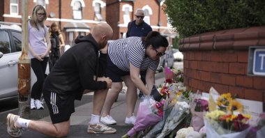 People leave flowers near the scene in Hart Street where two children died and nine were injured in a knife attack during a Taylor Swift-themed event at a dance school, Southport, U.K., July 30, 2024. (AP Photo)