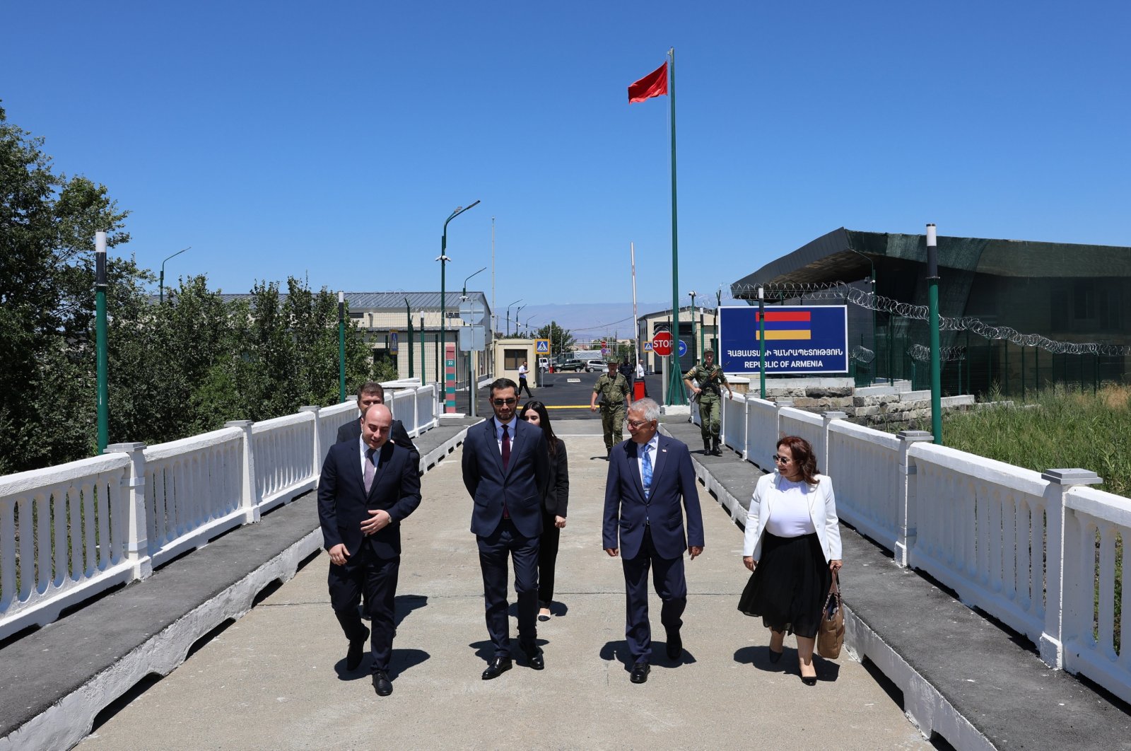 Türkiye&#039;s representative, Ambassador Serdar Kılıç (2nd R), and Armenia&#039;s representative, Ruben Rubinyan (2nd L), walk on the border between the two countries, July 30, 2024. (AA Photo)