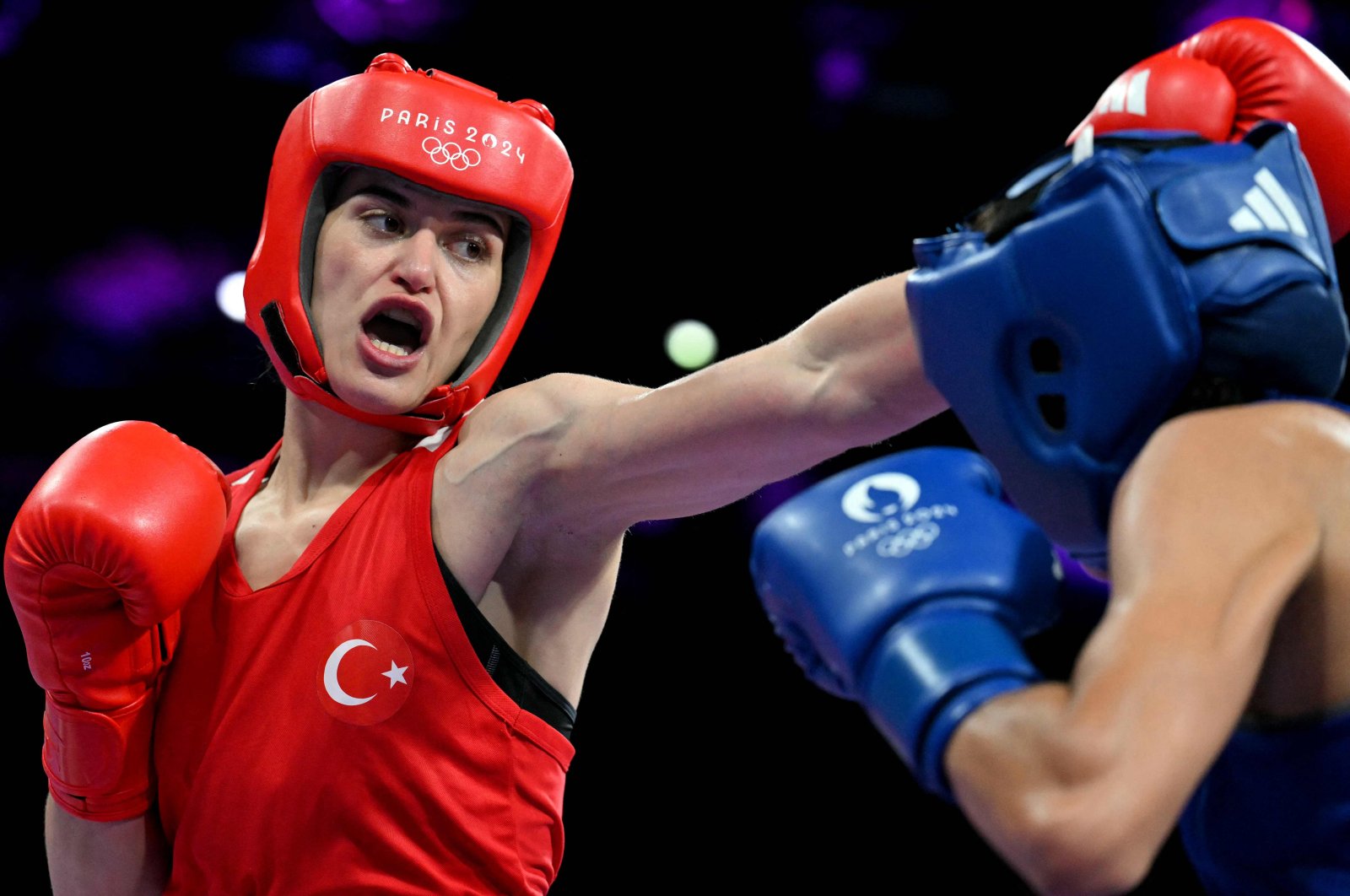 Türkiye&#039;s Esra Yıldız Kahraman (L) fights against Mali&#039;s Marine Camara in the women&#039;s 57 kg. preliminaries round of 32 boxing match during the Paris 2024 Olympic Games at the North Paris Arena, Villepinte, France, July 30, 2024. (AFP Photo)