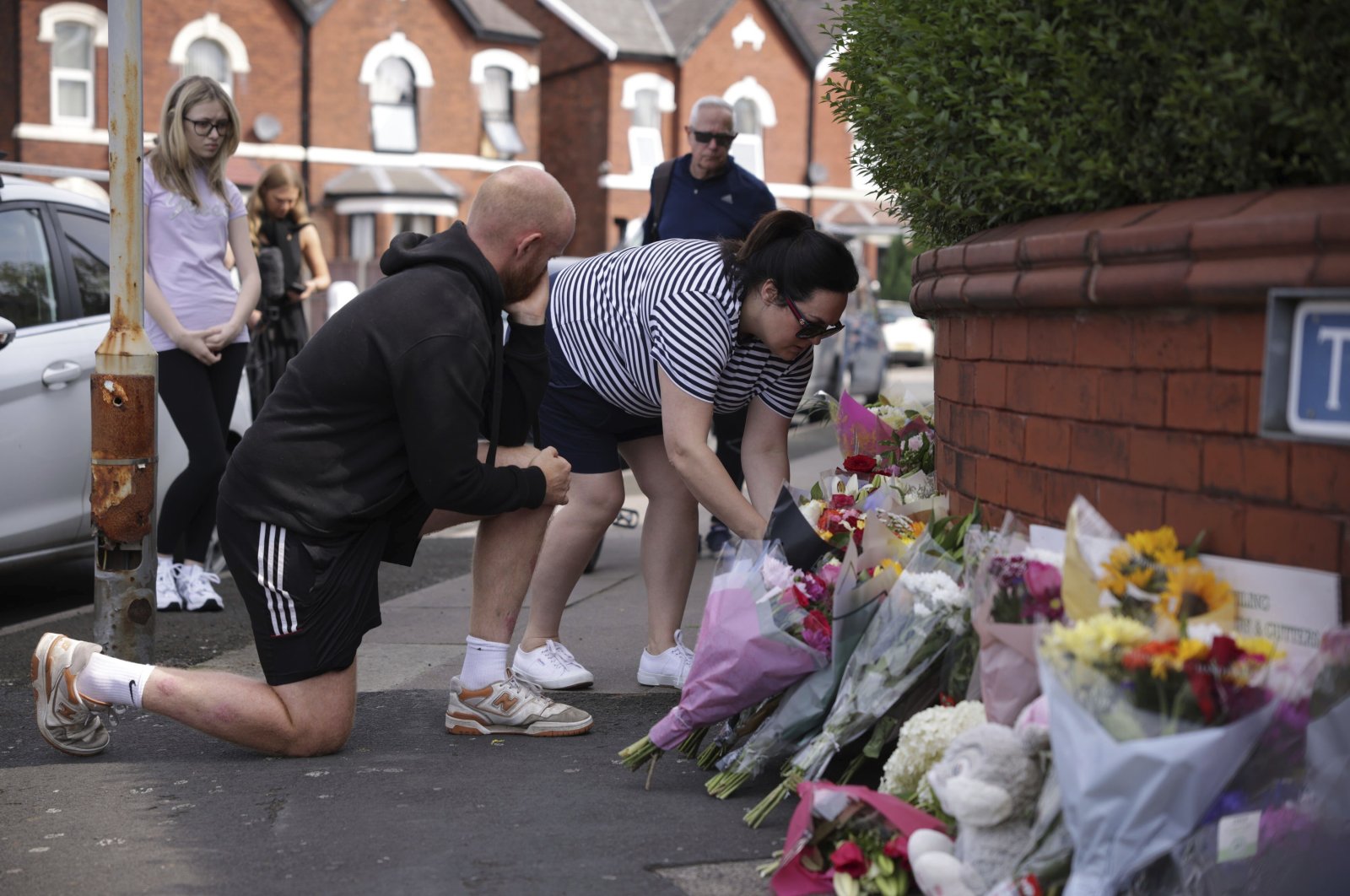 People leave flowers near the scene in Hart Street where two children died and nine were injured in a knife attack during a Taylor Swift-themed event at a dance school, Southport, U.K., July 30, 2024. (AP Photo)