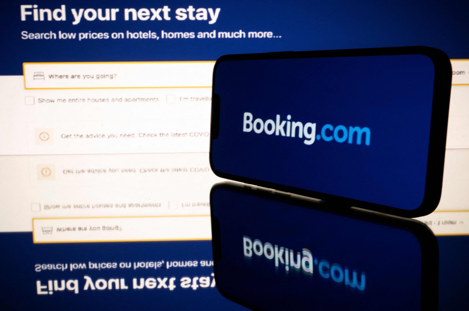 Screens displaying the logo and the website of the online travel and accommodation services platform Booking.com, Toulouse, France, Jan. 25, 2023. (AFP File Photo)