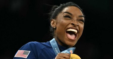 U.S.&#039; Simone Biles poses with the gold medal during the podium ceremony for the artistic gymnastics women&#039;s team final at the Paris 2024 Olympics, Bercy Arena, Paris, France, July 30, 2024. (AFP Photo)