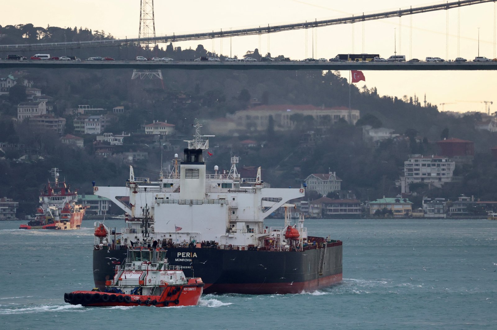 The Liberia-flagged tanker Peria is escorted by a Turkish coastal safety boat as it transits the Bosporus, Istanbul, Türkiye, Jan. 21, 2024. (Reuters Photo)