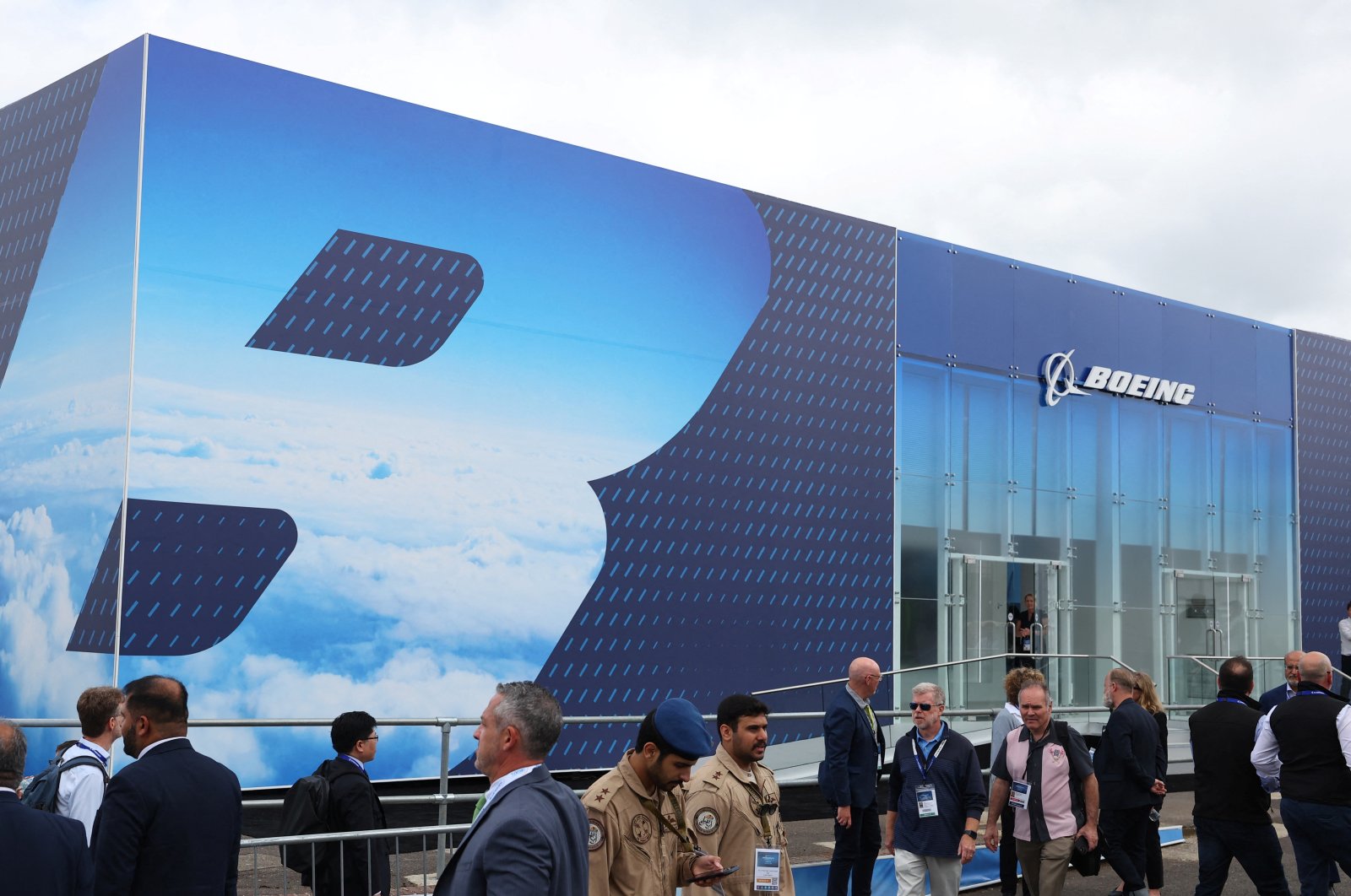 Attendees walk past Boeing branding at the Farnborough International Airshow, Farnborough, U.K., July 22, 2024. (Reuters Photo)