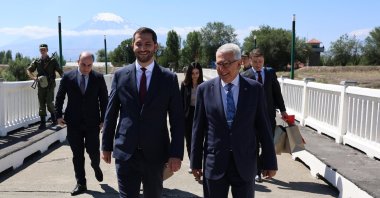 Türkiye&#039;s representative, Ambassador Serdar Kılıç (R), and Armenia&#039;s representative, Ruben Rubinyan (L), walk on the border between the two countries, July 30, 2024. (AA Photo)