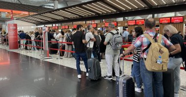 Passengers wait in front of counters at Istanbul Airport, Istanbul, Türkiye, July 19, 2024. (EPA Photo)
