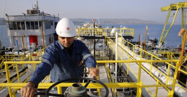 A worker checks the valve gears of pipes linked to oil tanks at the Mediterranean port of Ceyhan, which is run by the state-owned Petroleum Pipeline Corporation (BOTAŞ), some 70 kilometers (43.5 miles) from Adana, southern Türkiye, Feb. 19, 2014. (Reuters Photo)