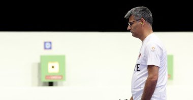 Türkiye&#039;s Yusuf Dikeç competes in the shooting 10-meter air pistol mixed team gold medal match during the Paris 2024 Olympic Games at Chateauroux Shooting Center, Paris, France, July 30, 2024. (AFP Photo)