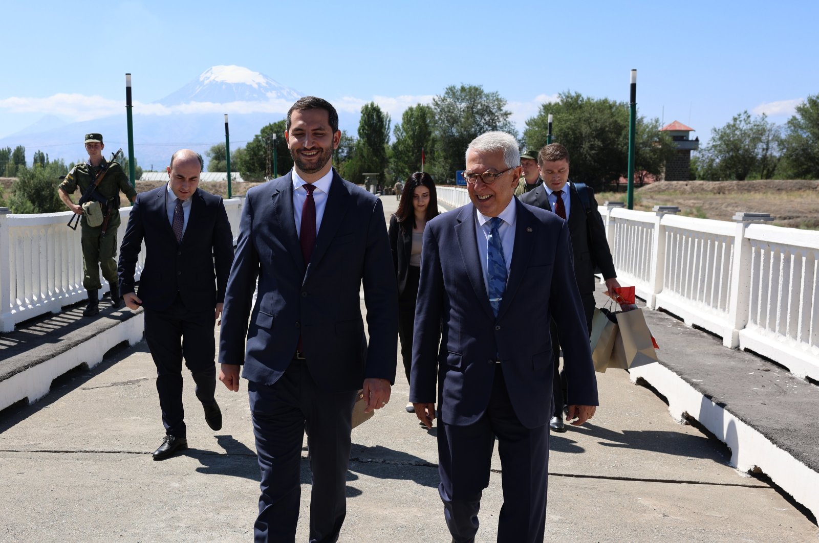 Türkiye&#039;s representative, Ambassador Serdar Kılıç (R), and Armenia&#039;s representative, Ruben Rubinyan (L), walk on the border between the two countries, July 30, 2024. (AA Photo)