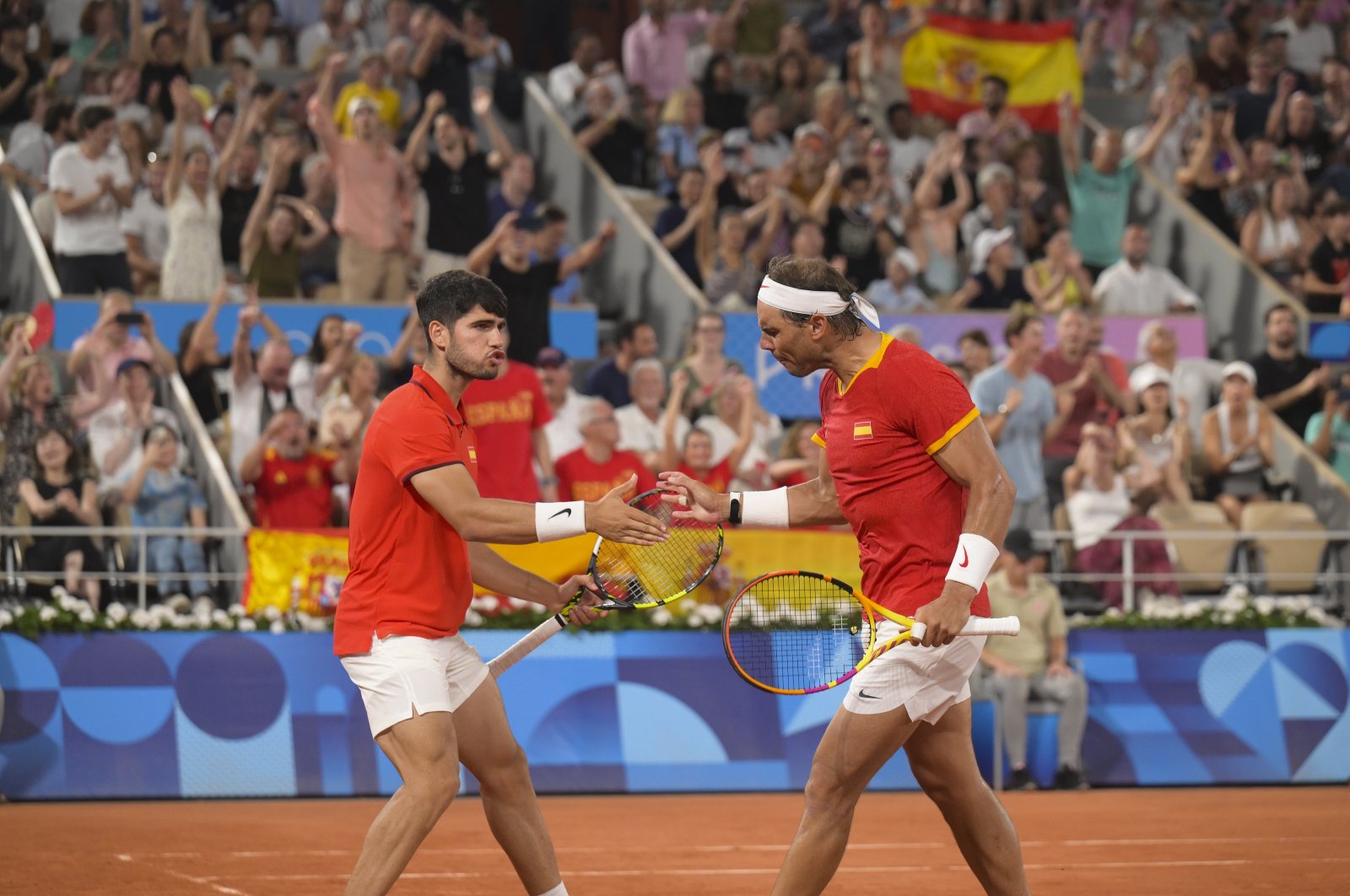 Spain&#039;s Carlos Alcaraz (L) and Rafael Nadal react during their Paris 2024 Olympics Men&#039;s Doubles Quarterfinals match against U.S.&#039; Austin Krajicek and Rajeev Ram at Roland-Garros Stadium, Paris, France, July 31, 2024. (Reuters Photo)