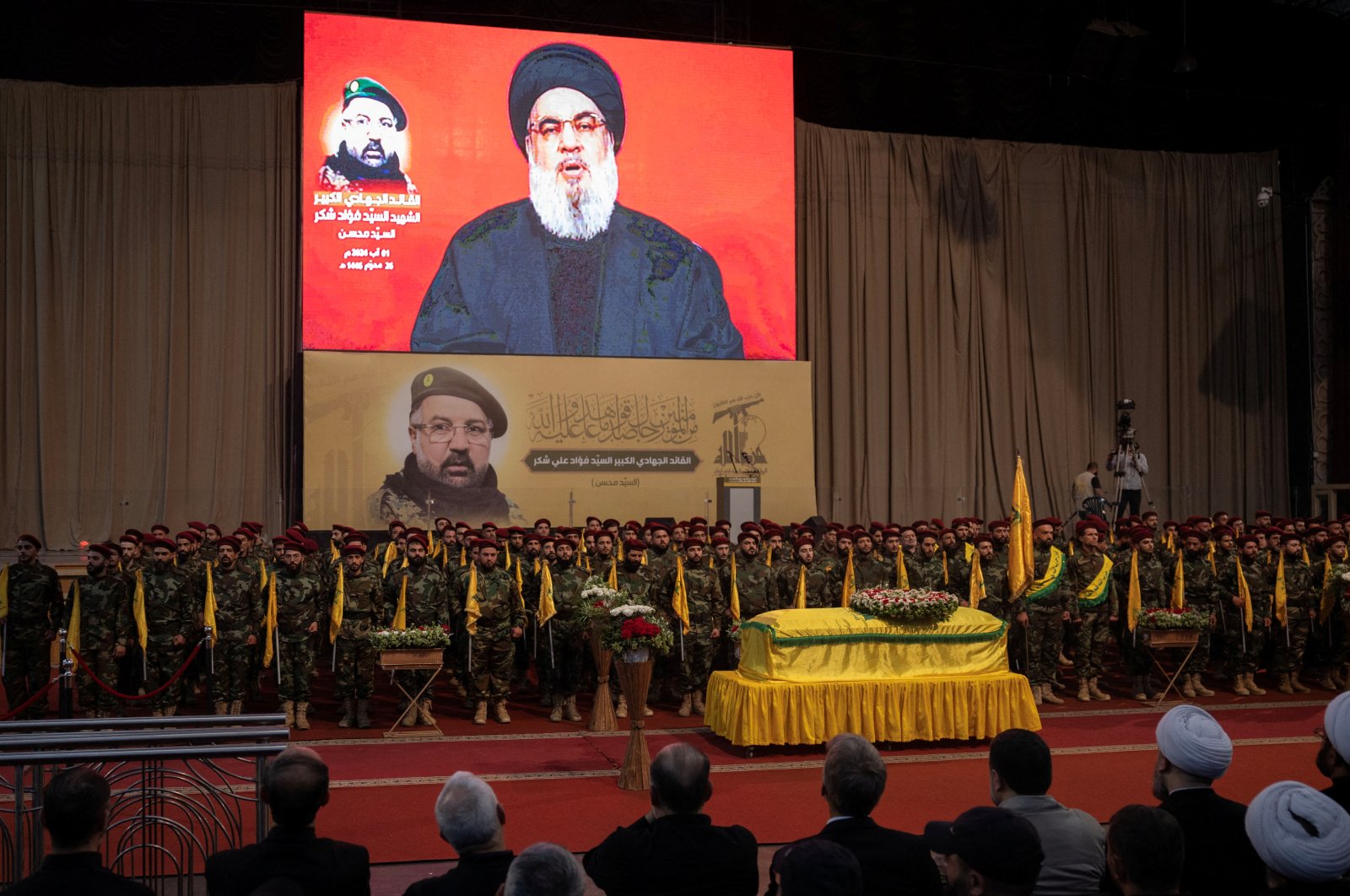 Lebanon&#039;s Hezbollah leader Sayyed Hassan Nasrallah appears on a screen as he addresses his supporters, during the funeral of Hezbollah senior commander Fuad Shukr, who was killed in an Israeli strike, in Beirut&#039;s southern suburbs, Lebanon Aug. 1, 2024. (Reuters Photo)