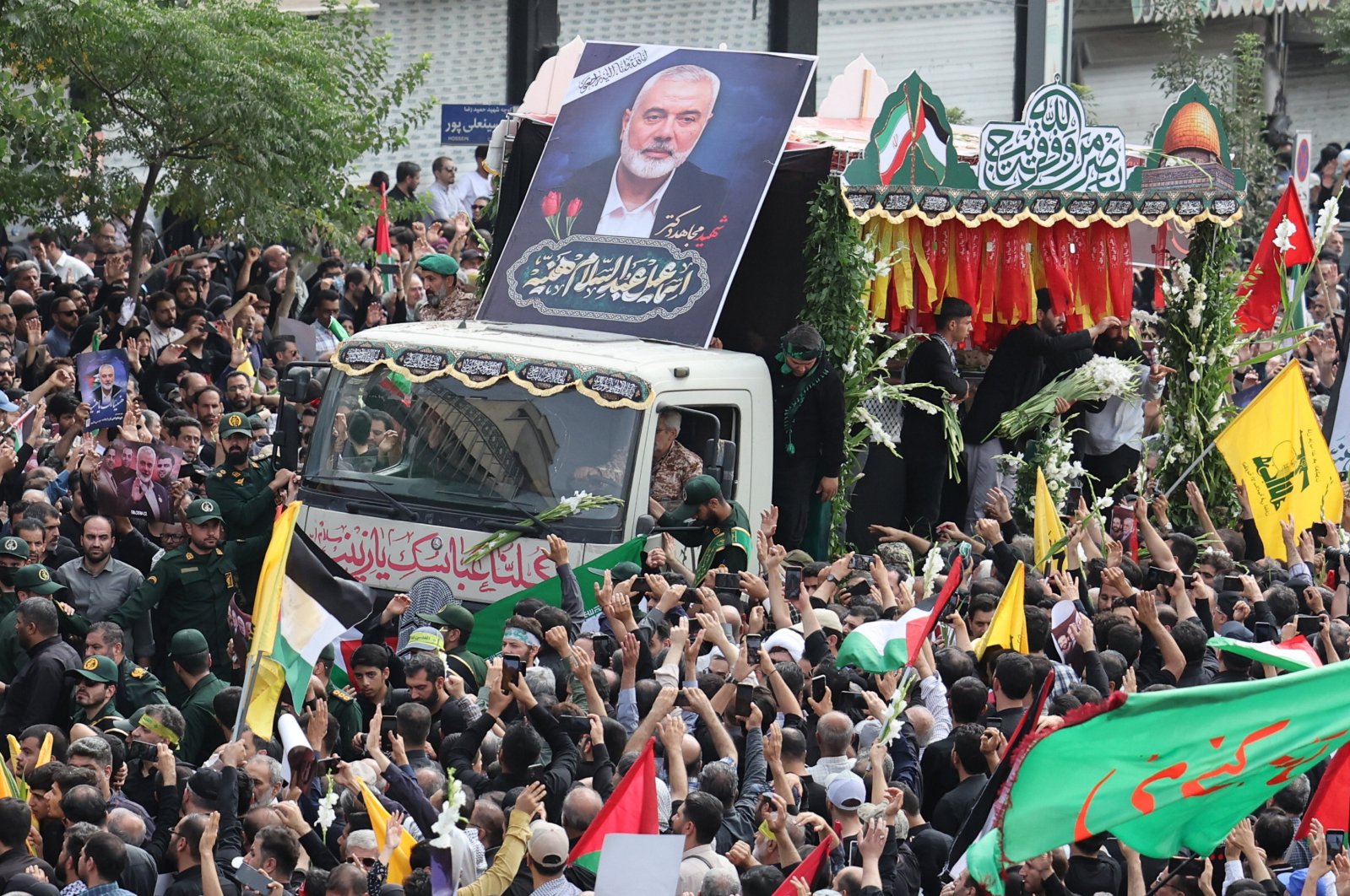 People gather around a truck carrying the coffins of Hamas&#039; late political leader Ismail Haniyeh and his bodyguard during a funeral procession in Tehran, Iran, Aug. 1, 2024. (EPA Photo)