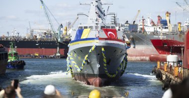 People react during the launching ceremony of the Ukrainian Navy&#039;s Ada class corvette &quot;Hetman Ivan Vyhovskyi,” Istanbul, Türkiye, Aug. 1, 2024. (Ukrainian Presidential Press Office via AP)