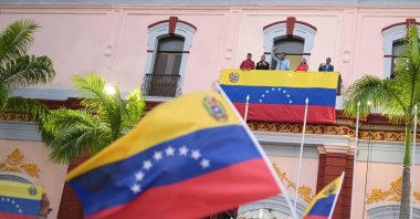 Venezuelan President Nicolas Maduro, accompanied by his wife Cilia Flores, delivers a speech to his supporters during a rally at the Miraflores presidential palace in Caracas on Aug.1, 2024. (AFP Photo)
