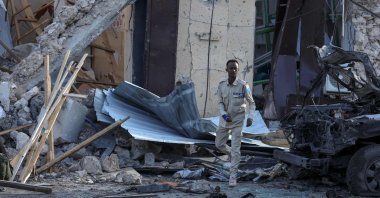  A Somalian police officer looks at debris and destruction at a cafe in Mogadishu, July 15, 2024. (AFP File Photo)