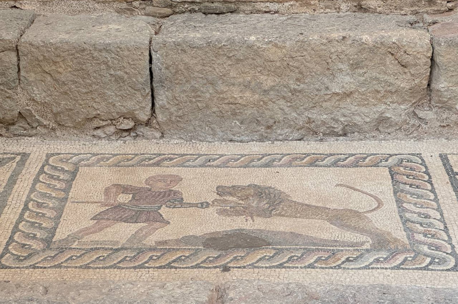 A mosaic showcases the struggle between a man and a lion, Antalya, Türkiye, July 31, 2024. (AA Photo)