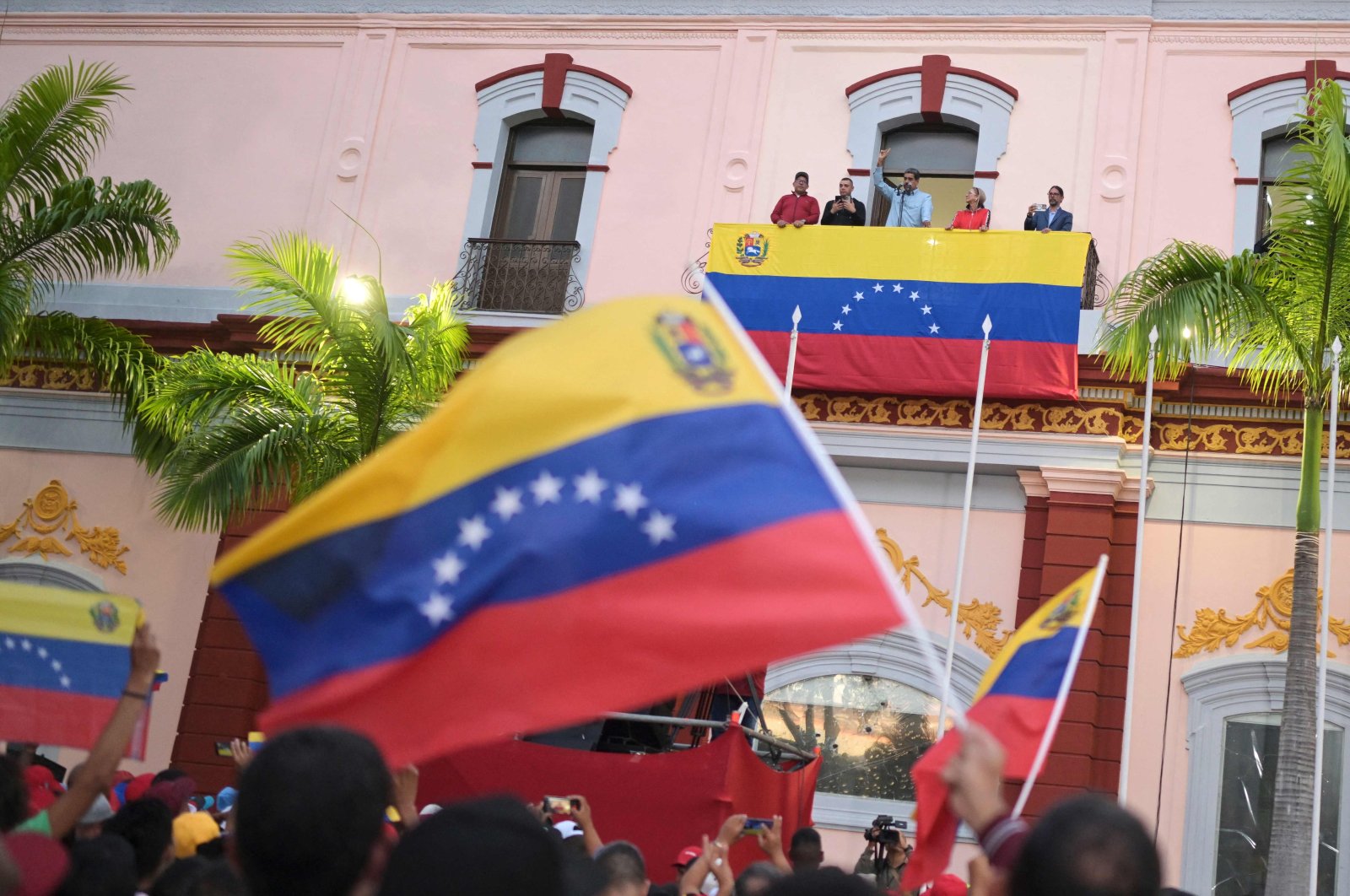 Venezuelan President Nicolas Maduro, accompanied by his wife Cilia Flores, delivers a speech to his supporters during a rally at the Miraflores presidential palace in Caracas on Aug.1, 2024. (AFP Photo)