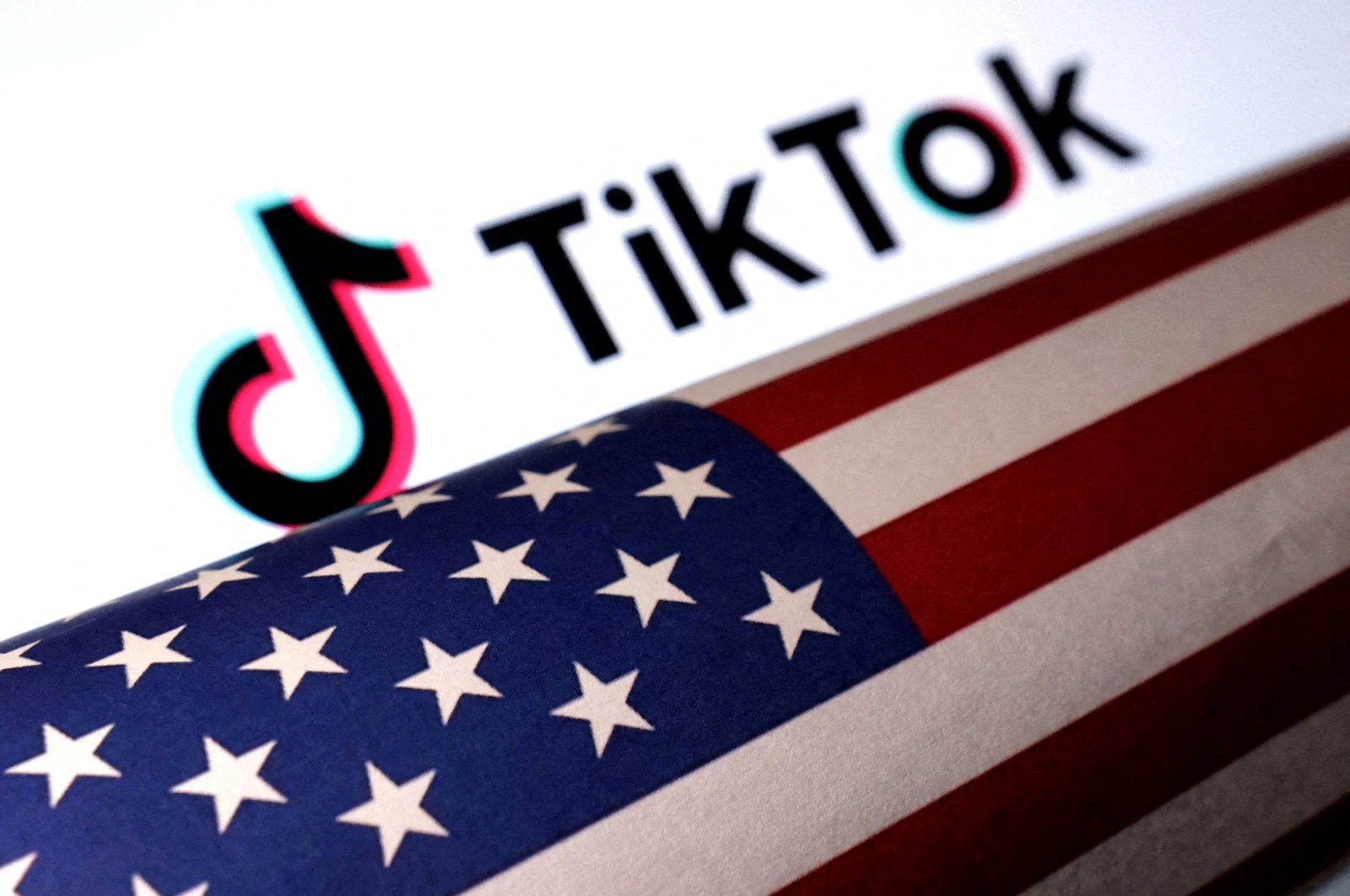  U.S. flag is placed on a TikTok logo in this illustration taken March 20, 2024. (Reuters File Photo)