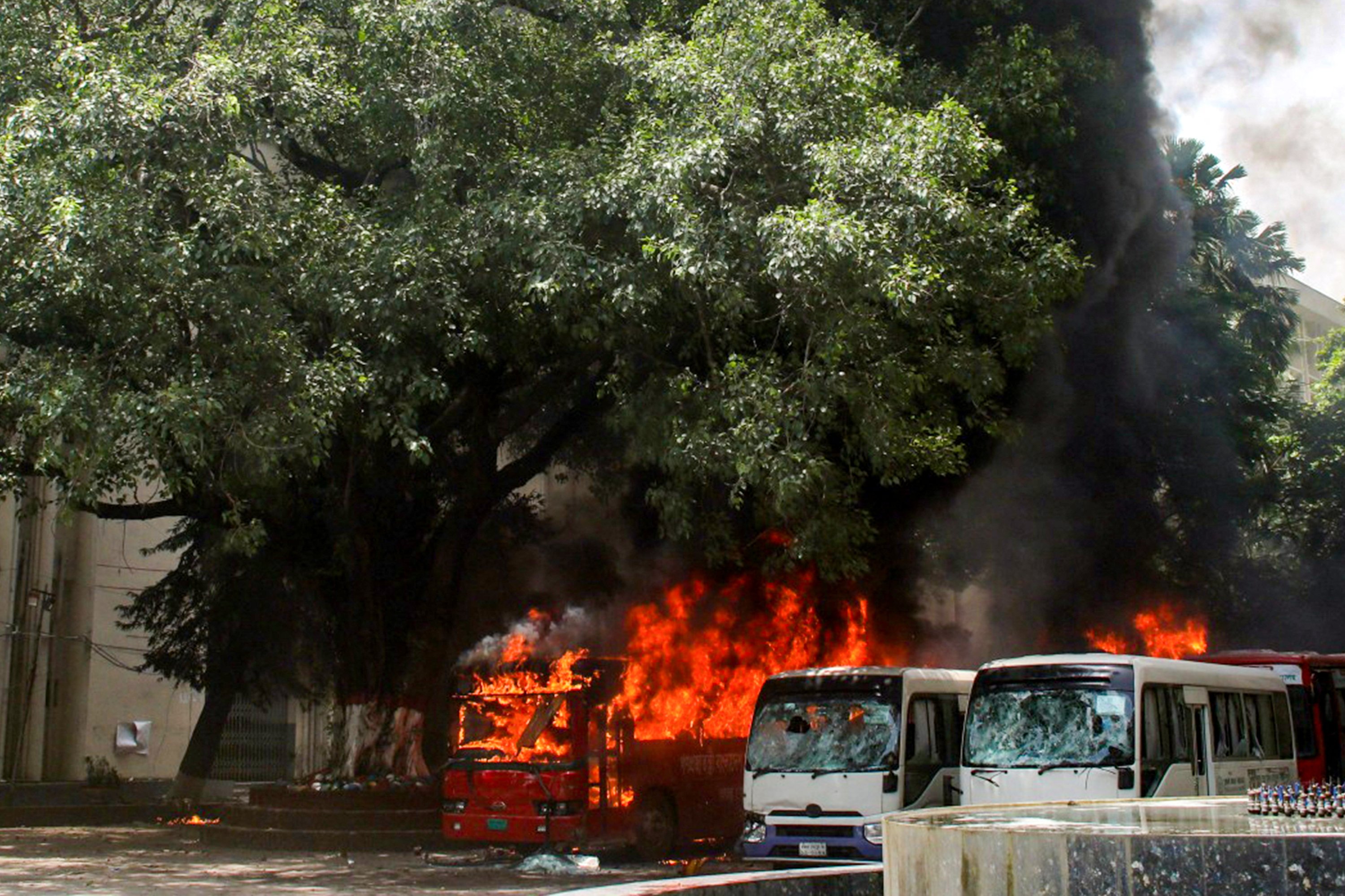 Buses are seen on fire at the Bangabandhu Sheikh Mujib Medical University premises after a clash between students and government supporters in Dhaka, Bangladesh, Aug. 4, 2024. (AFP Photo)