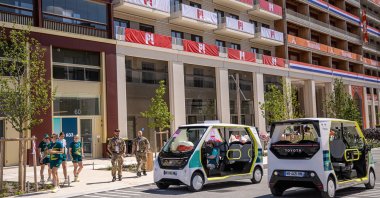 Electric shuttles drive at the Athletes' Village of the Paris 2024 Olympic Games in Saint Denis, France, July 18, 2024. (EPA Photo)