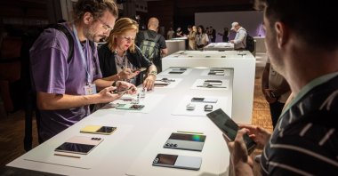 Guests take pictures of the new products during the Samsung Galaxy 2024 Unpacked event to unveil the next generation of artificial intelligence-powered Galaxy phones and devices at the Carrousel du Louvre venue, Paris, France, July 10, 2024. (EPA Photo)