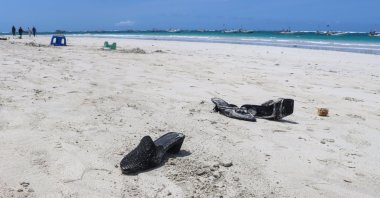 Shoes belonging to the victims of a suicide bombing litter a beach in Mogadishu, Somalia, Aug. 3, 2024. (EPA Photo)