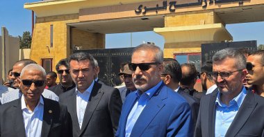 Foreign Minister Hakan Fidan (C) meets with Egypt&#039;s North Sinai Governor Khaled Megawer (L) as he arrives at the Rafah border crossing between Egypt and the Gaza Strip, Aug. 4, 2024. (Reuters Photo)
