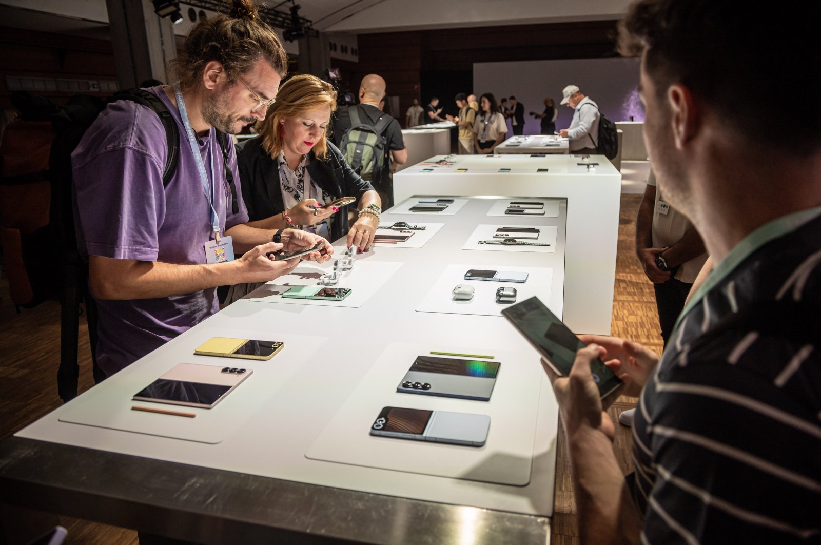 Guests take pictures of the new products during the Samsung Galaxy 2024 Unpacked event to unveil the next generation of artificial intelligence-powered Galaxy phones and devices at the Carrousel du Louvre venue, Paris, France, July 10, 2024. (EPA Photo)